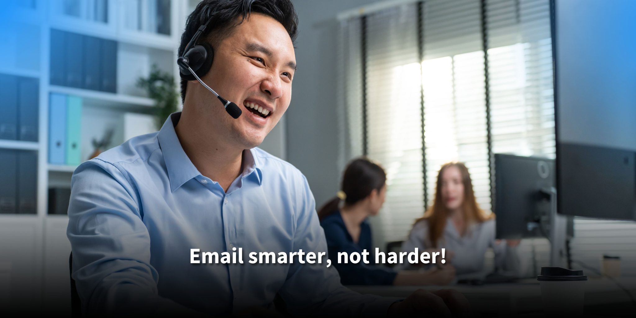 A smiling male customer service agent wearing a headset in a bright office, with colleagues working in the background. Text reads: 'Email smarter, not harder!