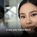 A confident female call center agent wearing a headset, with a male colleague blurred in the background. Text reads: 'Crazy pay starts here!