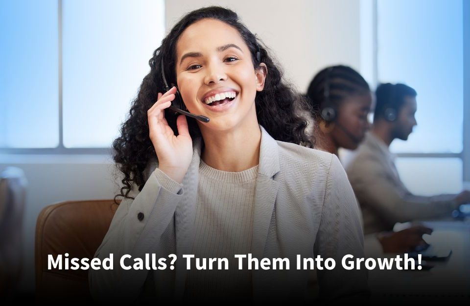 Smiling customer service representative with a headset assisting a caller in a professional office environment, with colleagues working in the background.