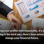 Business professionals analyzing colorful financial charts and graphs on a wooden table, symbolizing collaborative financial planning. Outsourcing financial planning helps optimize strategies, minimize risks, and maximize profits for sustainable growth.