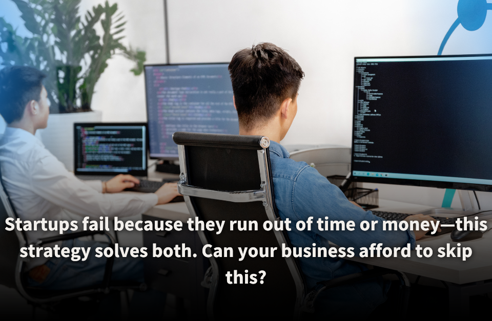 Two developers working at their desks, focused on coding displayed on multiple computer monitors. The scene highlights the critical importance of efficient strategies to save time and money for startup success.