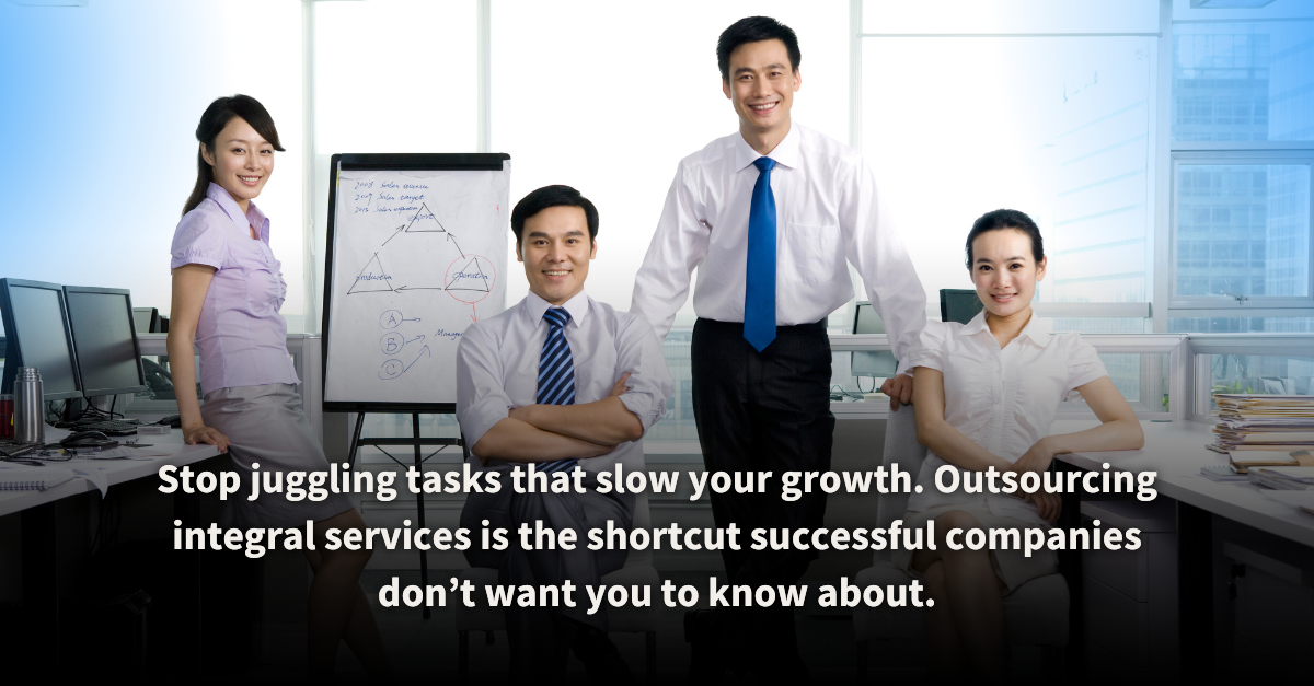 A team of confident professionals in a modern office setting, standing and seated around a whiteboard with strategic diagrams. The image represents the benefits of outsourcing integral services to accelerate business growth and streamline operations.