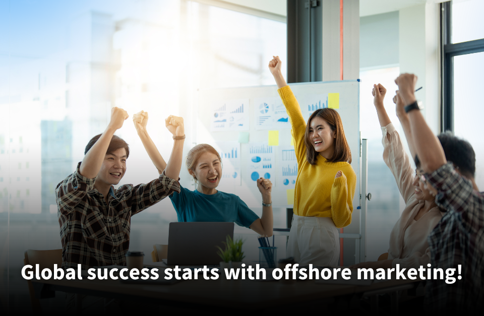 A group of cheerful team members celebrating success in a bright office, with charts and graphs displayed on a whiteboard in the background. Text overlay reads: 'Global success starts with offshore marketing!